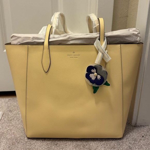 kate spade Handbags - Kate Spade Cream Tote with Floral Charm